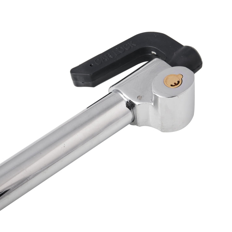 Close-up of steering wheel lock head with locking cylinder and black rubber handle
