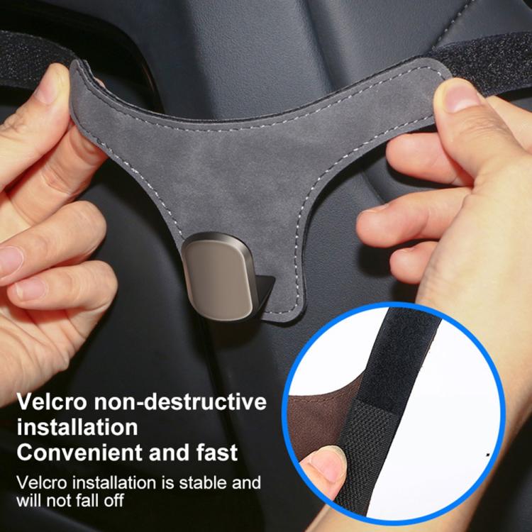 Grey car seat back hanger hook with suede strap, metal clip, and hook-and-loop tab