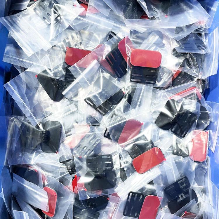 Multiple rear camera adhesive mounting brackets in clear plastic bag