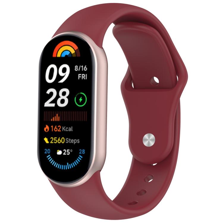 Wine red silicone watch band with reverse buckle fitted to a fitness tracker