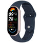 Dark blue silicone watch band with reverse buckle fitted to a fitness tracker