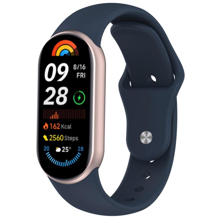 Dark blue silicone watch band with reverse buckle fitted to a fitness tracker