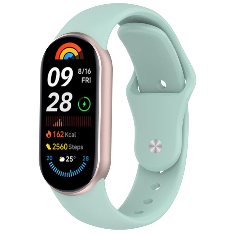 Mint silicone reverse-buckle watch band shown attached to a fitness tracker