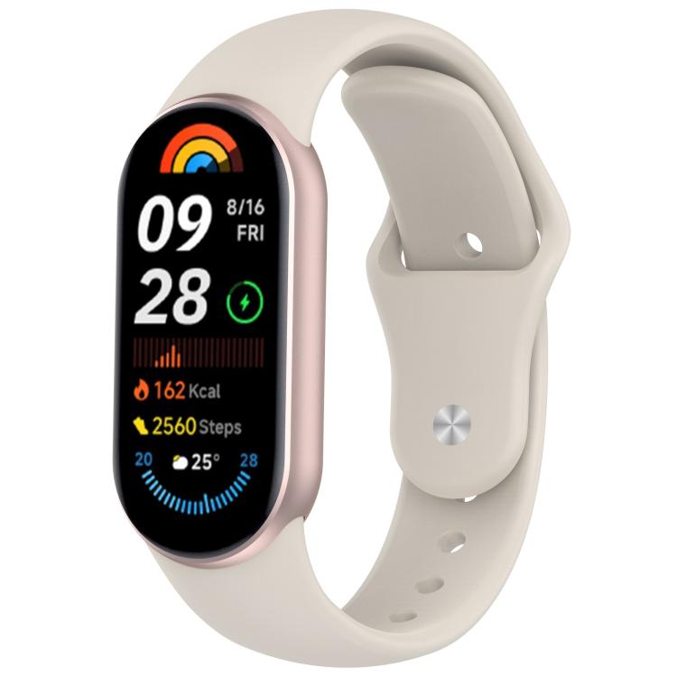 Cream silicone reverse-buckle watch band shown attached to a fitness tracker