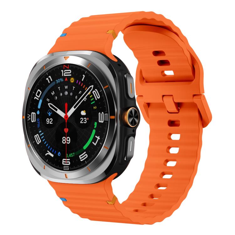 Orange silicone watch band with ridged texture, shown on a Galaxy Watch Ultra2