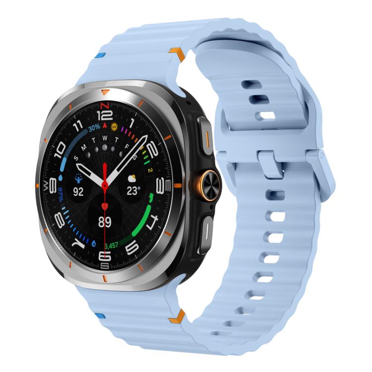 Light blue silicone watch band with ridged detailing, shown fitted to a smartwatch.