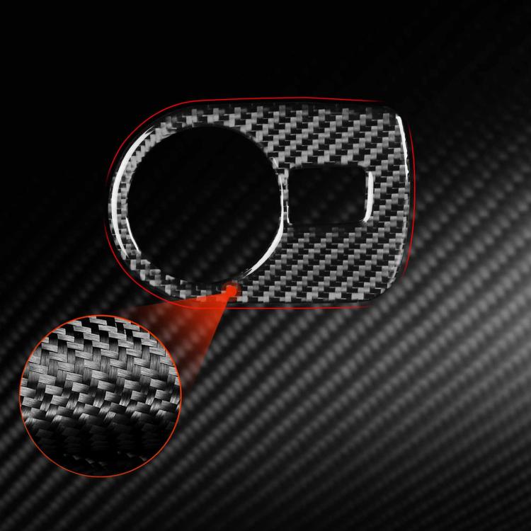 Black carbon fiber headlight switch panel trim sticker detail with textured weave