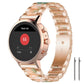 Rose gold metal watch band with peach and green resin links, shown on a smartwatch.