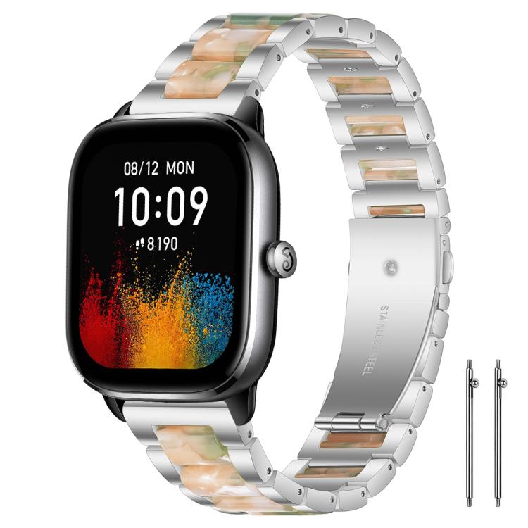 Silver metal watch band with green and peach resin links on a rectangular watch