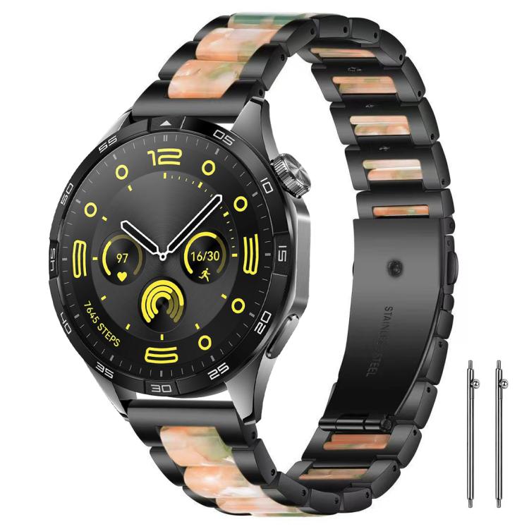 Black metal watch band with peach and green resin links, shown on a black smartwatch.