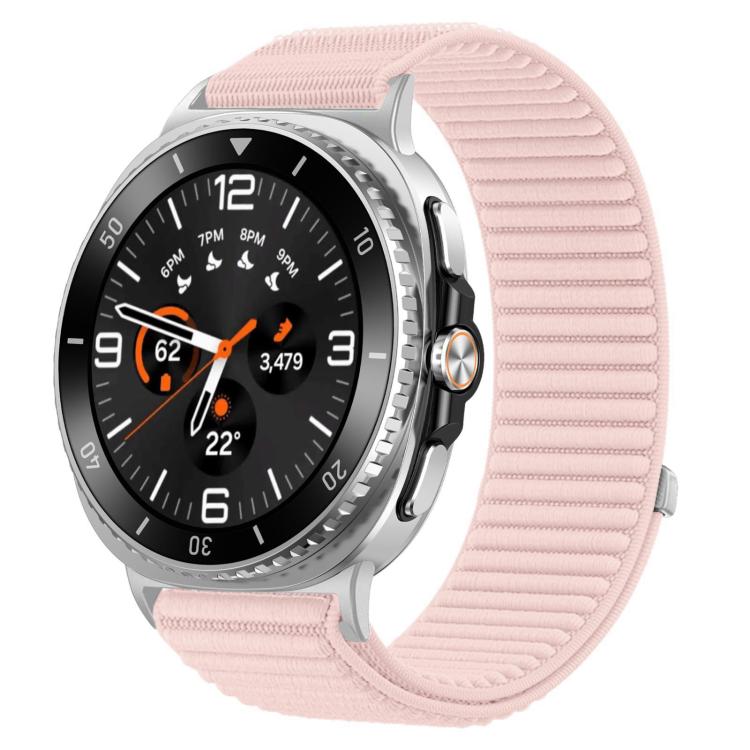 Pale pink woven nylon hook-and-loop watch band fitted to a silver smartwatch