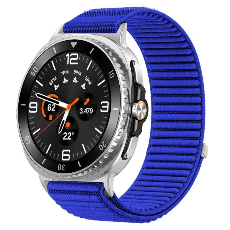 Bright blue woven nylon hook-and-loop watch band fitted to a silver smartwatch