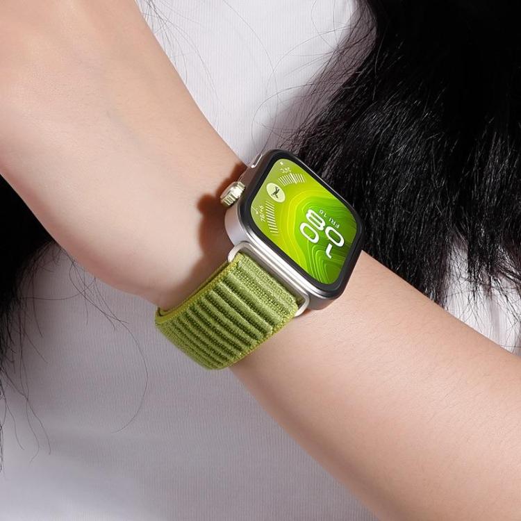 Green woven nylon watch band worn on a wrist with a smartwatch