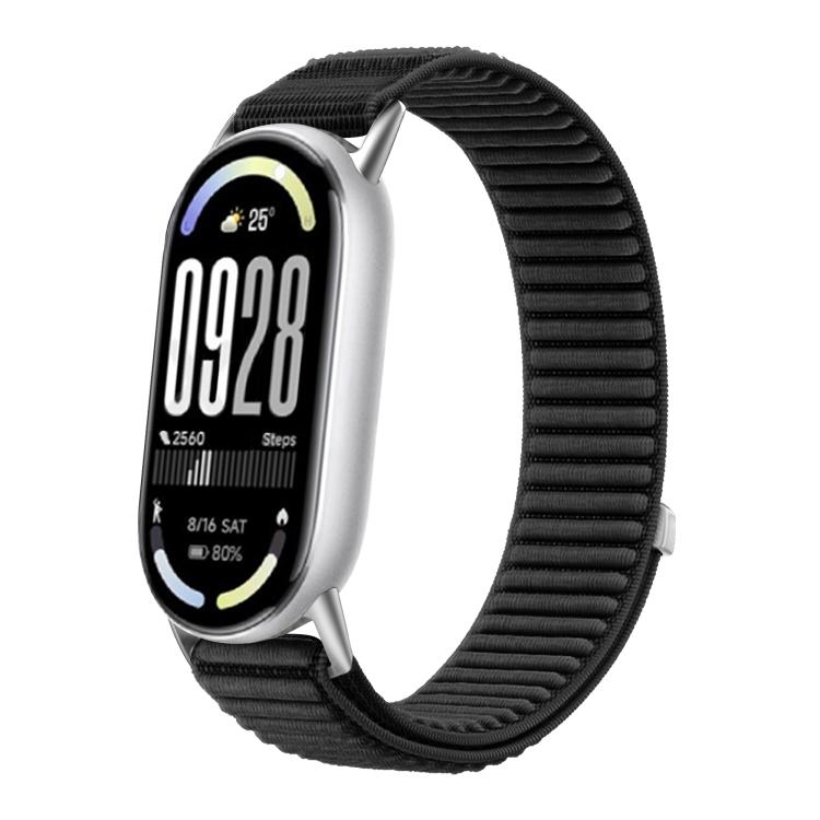 Woven nylon watch band in black with hook-and-loop closure, shown on a fitness tracker.