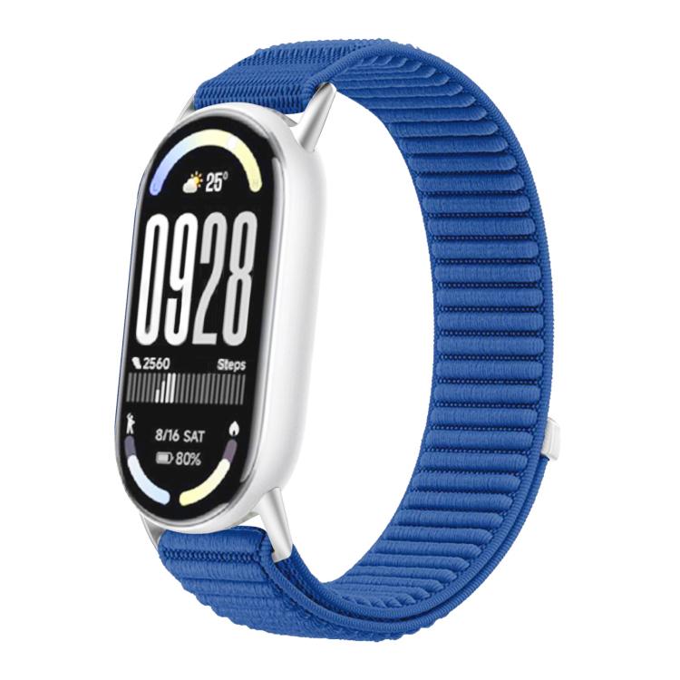 Woven nylon watch band in blue with hook-and-loop closure, shown on a fitness tracker.