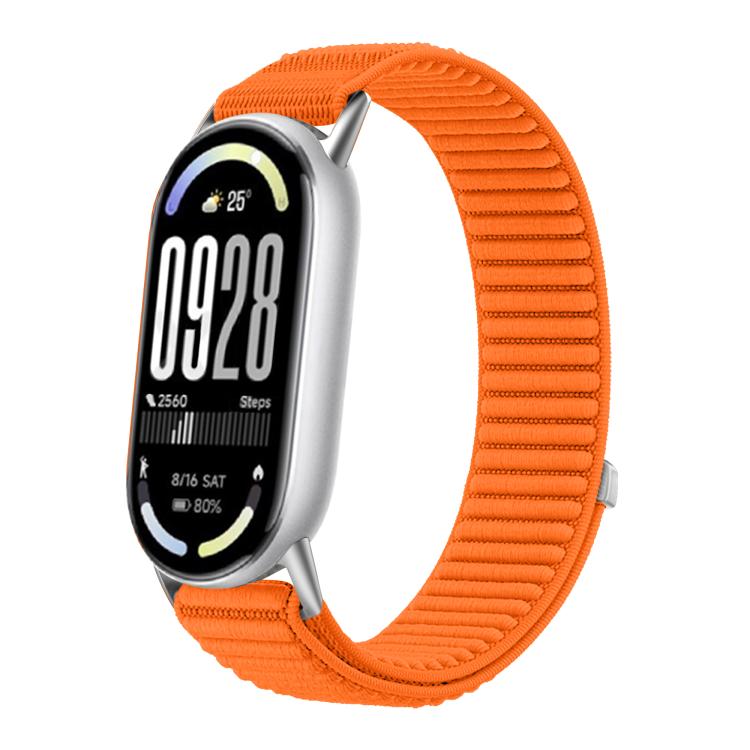 Woven nylon watch band in bright orange with hook-and-loop closure, shown on a fitness tracker.