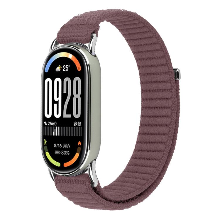 Woven nylon watch band in muted purple with hook-and-loop closure, shown on a fitness tracker.