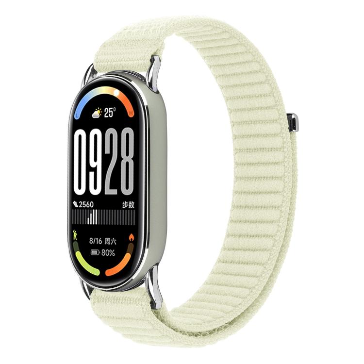 Woven nylon watch band in pale cream with hook-and-loop closure, shown on a fitness tracker.