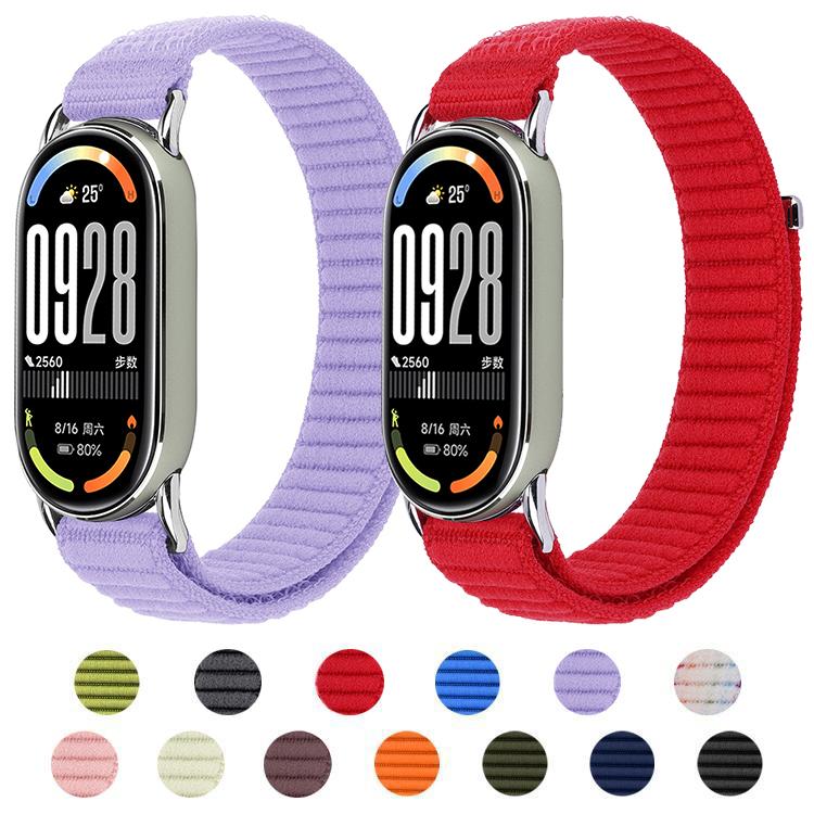 Woven nylon watch band assortment in lavender, red, blue, green, black, and other colors.