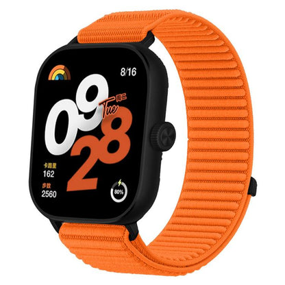 Orange woven nylon hook-and-loop smartwatch band with black watch case