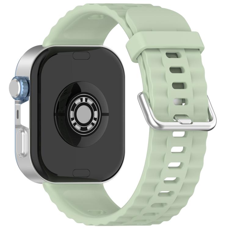 Light green silicone watch band with silver buckle, shown on a smartwatch