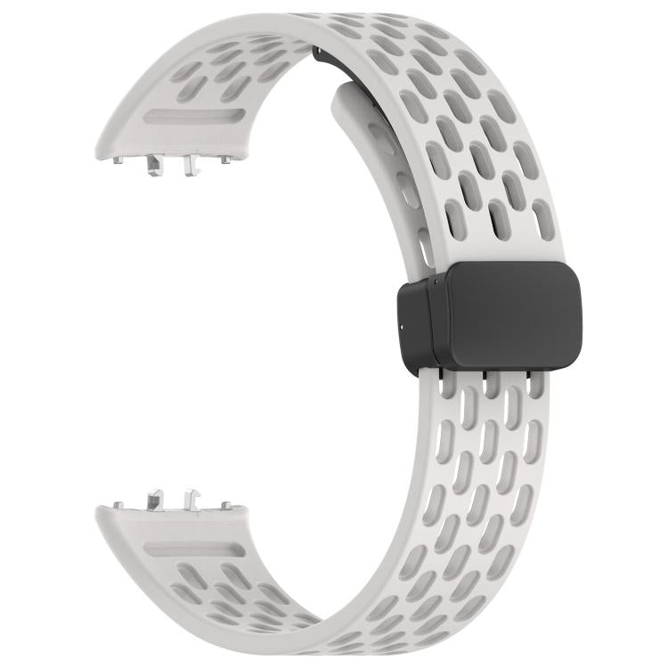 White perforated silicone watch band with black magnetic buckle, shown without the watch