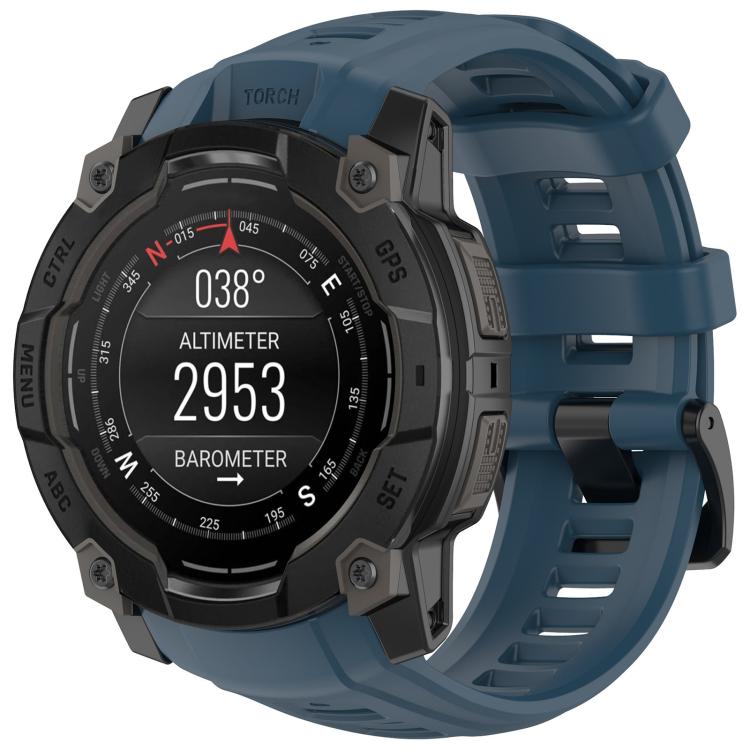 Quick-release silicone watch band in dark teal on a rugged Garmin watch