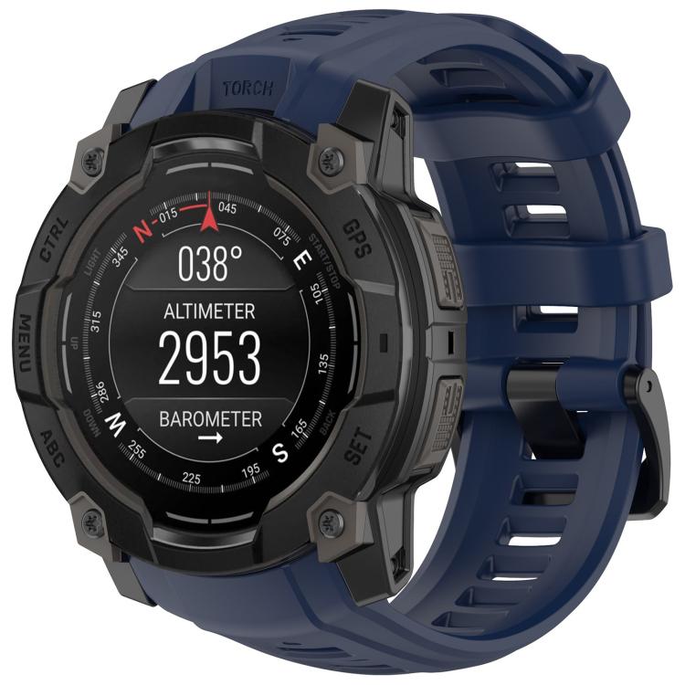 Quick-release silicone watch band in navy blue on a rugged Garmin watch