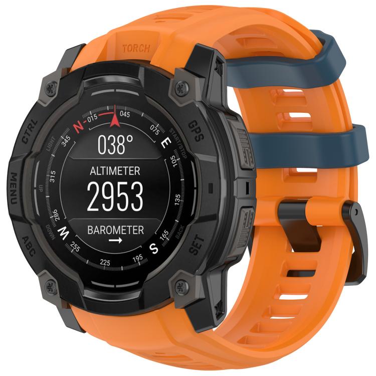 Quick-release silicone watch band in orange with blue accents, fitted to a rugged smartwatch