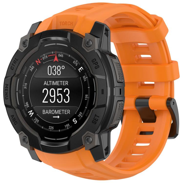 Quick-release silicone watch band in bright orange, fitted to a rugged smartwatch