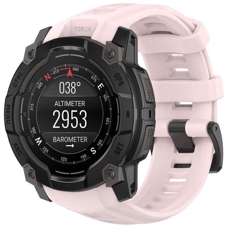 Quick-release silicone watch band in pale pink, fitted to a rugged smartwatch