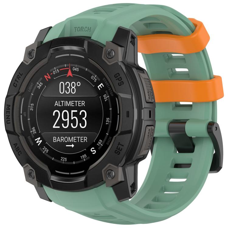 Mint green silicone watch band with orange accents