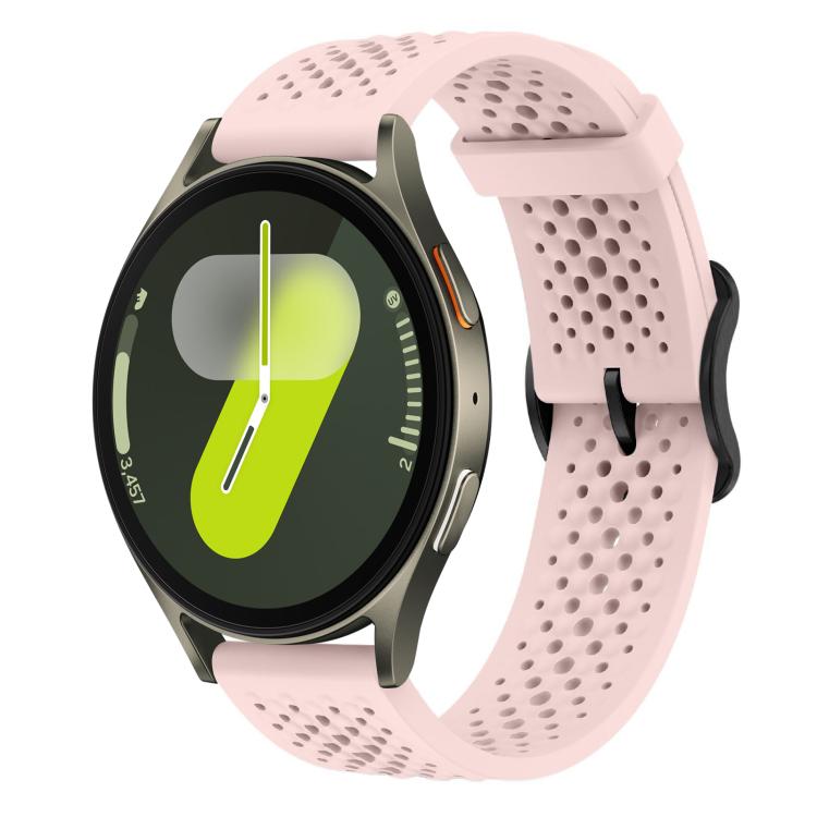 Pale pink perforated silicone watch band with a round smartwatch