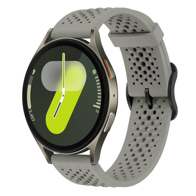 Gray perforated silicone watch band with a round smartwatch