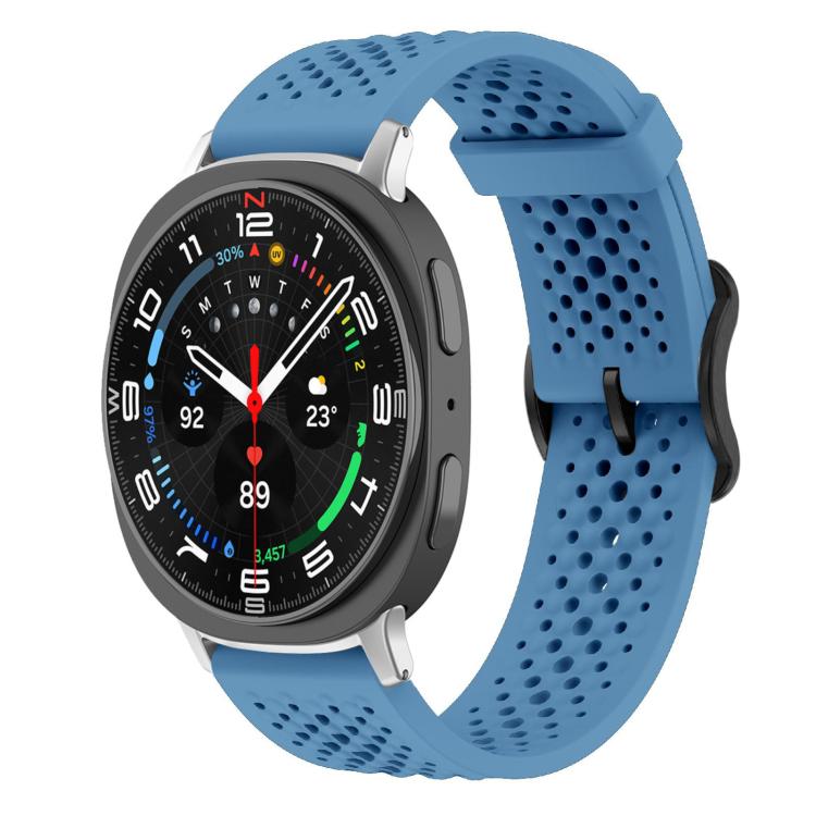 Blue perforated silicone watch band with a round smartwatch