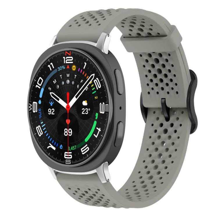 Gray perforated silicone watch band with a round smartwatch