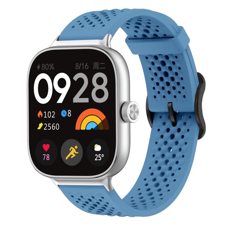 Blue perforated silicone watch band with silver smartwatch