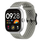 Gray perforated silicone watch band with silver smartwatch