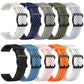 Assorted perforated silicone watch bands in multiple colors, shown from the buckle side