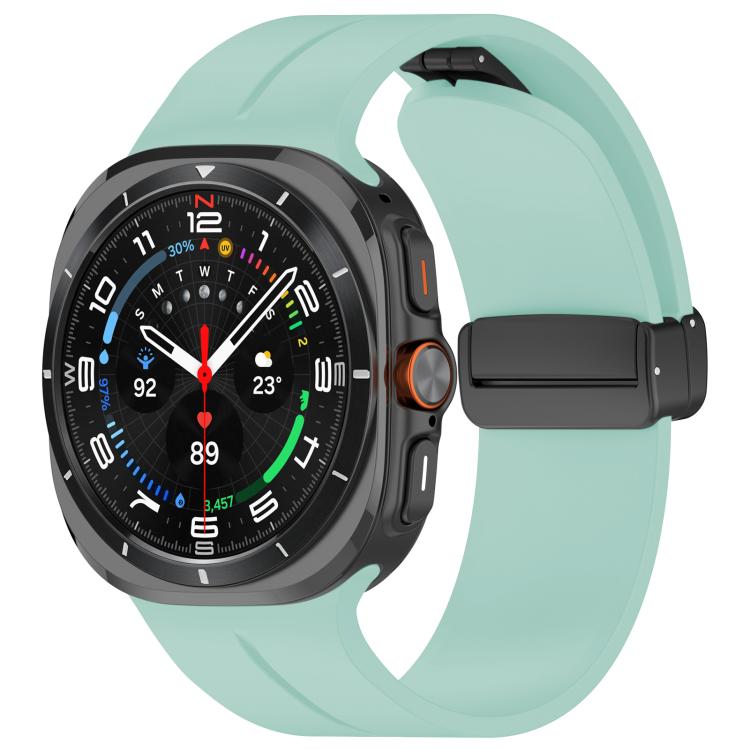 Emerald green silicone watch band with black folding buckle fitted to a smartwatch