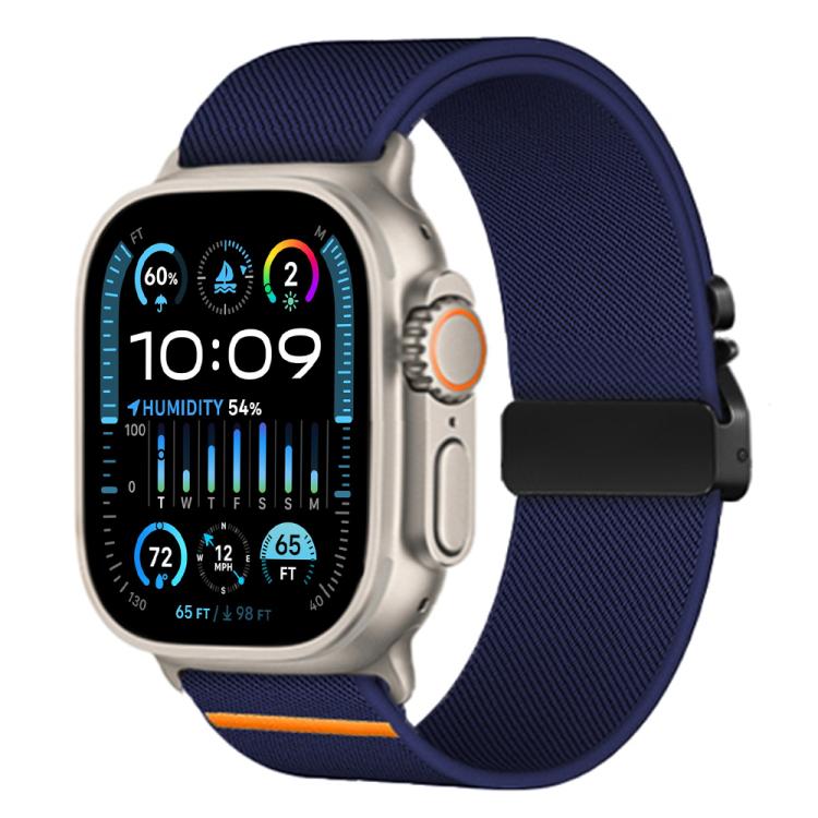 Midnight blue xDfind nylon watch band with parachute buckle and orange accent, shown on Apple Watch