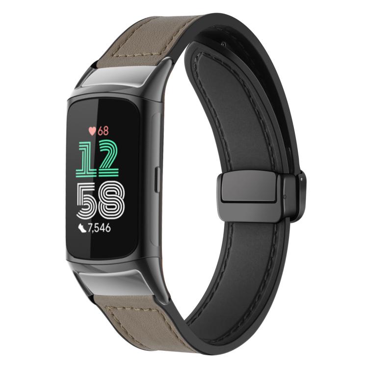 Taupe silicone watch band with stitched pattern and magnetic buckle on a fitness tracker