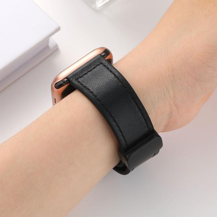 Black stitched watch band with magnetic buckle worn on a wrist