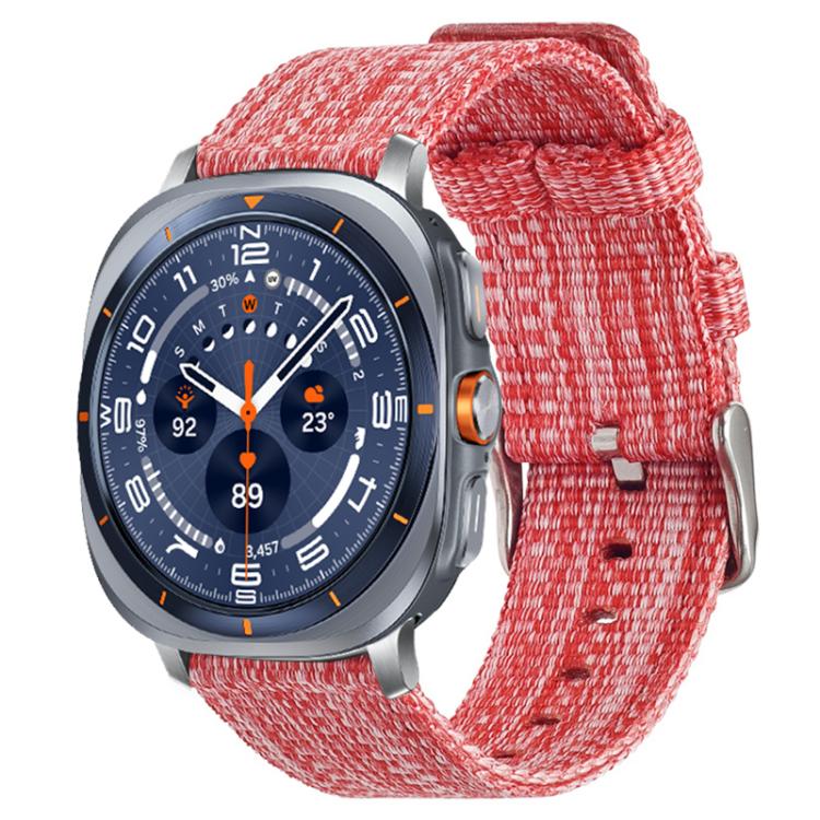 Red nylon canvas watch band on a silver smartwatch with a blue dial
