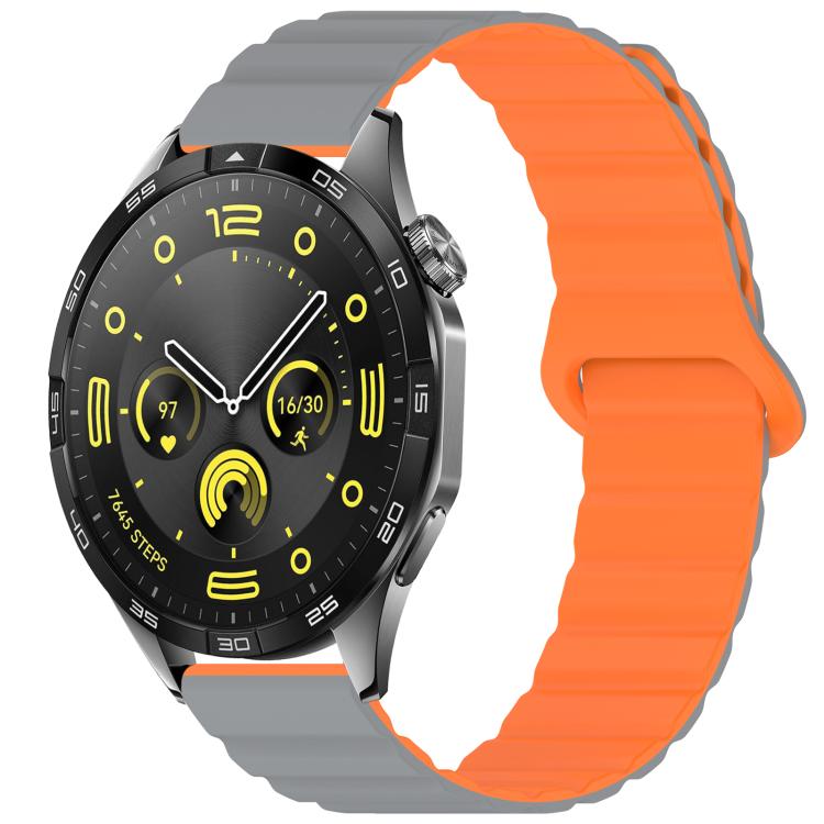 Silicone watch band in gray and orange with a magnetic loop closure, shown on a watch.
