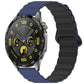 Silicone watch band in navy and black with a magnetic loop closure, shown on a watch.