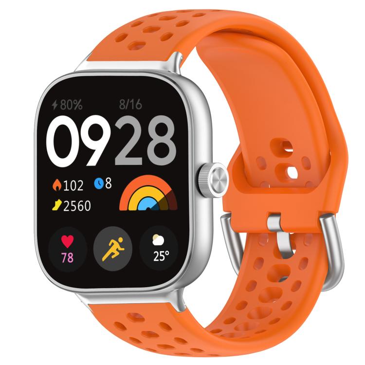 Orange perforated silicone sport watch band with silver buckle on a smartwatch