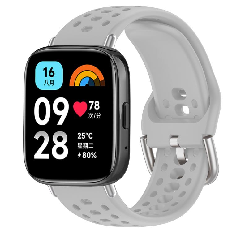 Light gray perforated silicone sport watch band with silver buckle, shown on a smartwatch