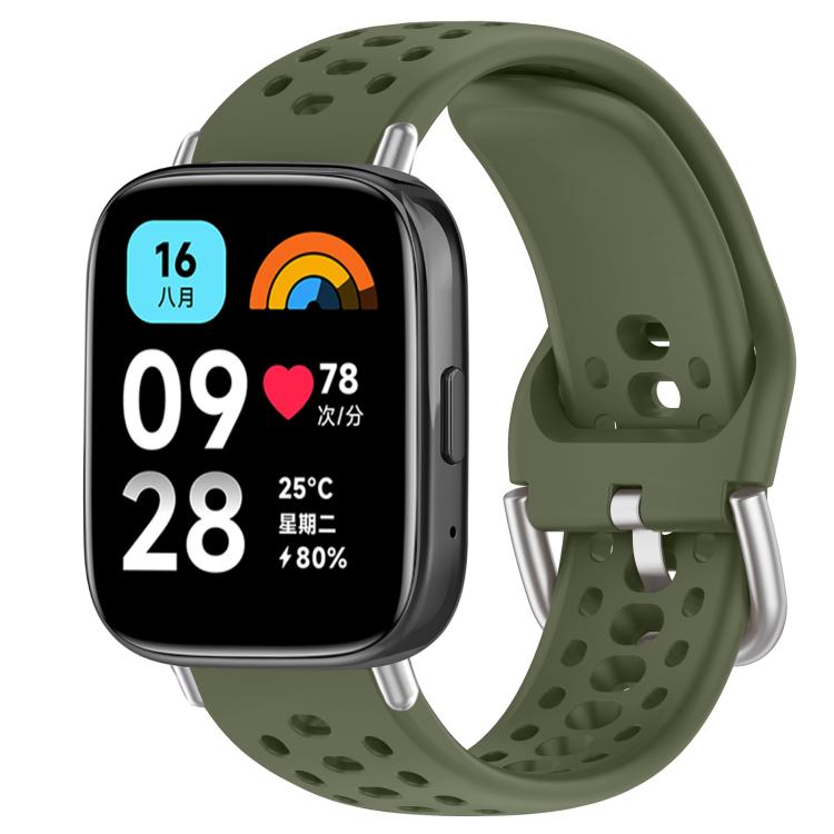 Army green perforated silicone sport watch band with silver buckle, shown on a smartwatch