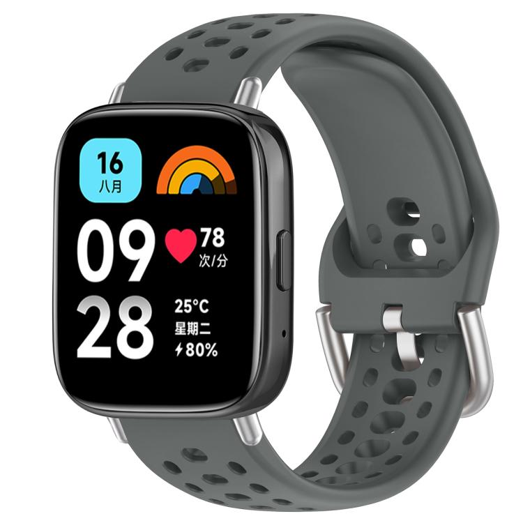 Gray perforated silicone sport watch band with silver buckle, shown on a smartwatch